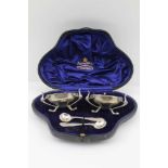 MAPPIN & WEBB A CASED PAIR OF SILVER SALTS of Art Nouveau form with gilded interiors, London 1907,