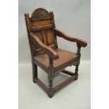 A POSSIBLE 19TH CENTURY, 17TH CENTURY DESIGN PANELLED BACK DEEP SEATED WAINSCOTE ARMCHAIR, on turned