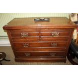 A LATE 19TH CENTURY WALNUT COLOURED FOUR-DRAWER CHEST on plain plinth base