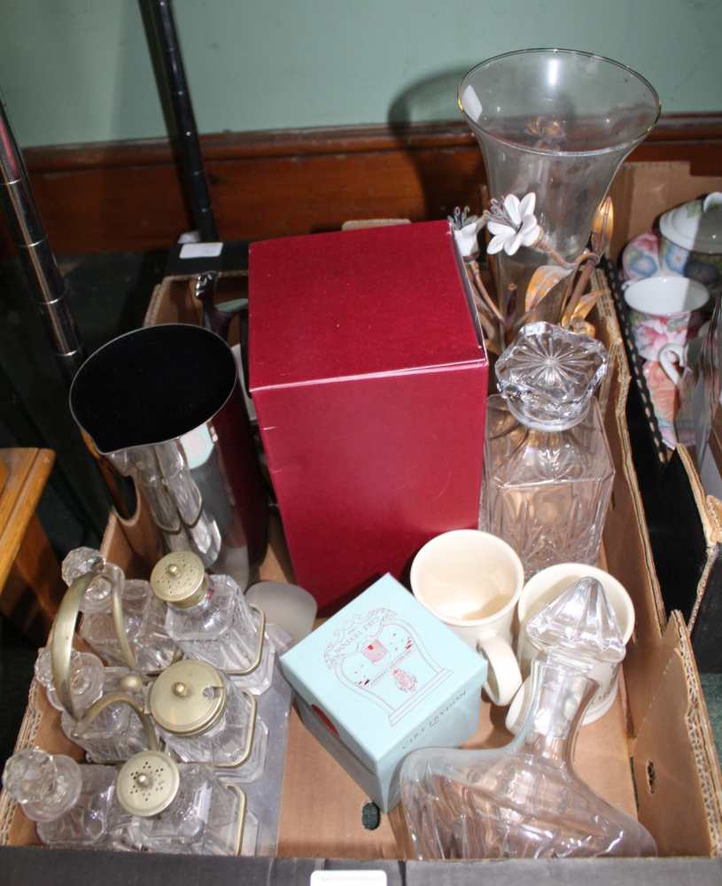 A BOX CONTAINING GLASS DECANTERS & STOPPERS, an early 20th century six bottle table cruet, etc.