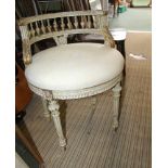 A CONTINENTAL DESIGN DISTRESSED PAINT EFFECT SPINDLE BACKED OVAL SEATED CHAIR on reeded tapering