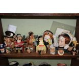 A SHELF FULL OF ROYAL DOULTON CHARACTER JUGS AND TEAPOTS