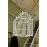 A DECORATIVE PAINTED BIRDCAGE