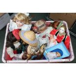 A LARGE CRATE CONTAINING A SELECTION OF DOLLS VARIOUS