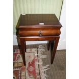 A MAHOGANY FINISHED LOCKABLE BOX TOP OCCASIONAL TABLE