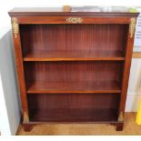 A PAIR OF CONTINENTAL DESIGN MAHOGANY OPEN FRONTED NARROW SETS OF SHELVES with decorative cast brass