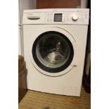 A WHITE FINISHED UNDER-COUNTER BOSCH VARIOPERFECT WASHING MACHINE