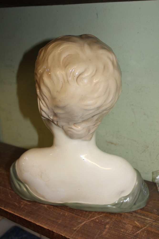 A CONTINENTAL POTTERY BUST OF A CHILD, 29cm high, (factory mark inside) - Image 2 of 2