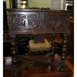 A 17TH CENTURY DESIGN OAK BOX TOPPED SIDE TABLE , with probably later carved front, supported on