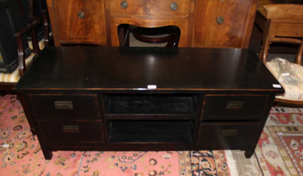 A BLACK FINISHED OVERSIZED TV STAND with a selection of audio visual storage drawers