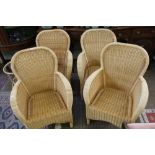 FOUR WELL MADE WOVEN RATTAN CONSERVATORY STYLE ARMCHAIRS together with a bamboo, circular glass