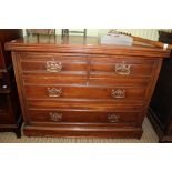 A LATE 19TH CENTURY WALNUT COLOURED FOUR-DRAWER CHEST on plain plinth base