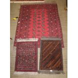 THREE WOVEN WOOLEN FLOOR RUGS, to include standard pigeon red ground hearth size, and two