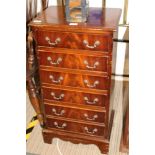 A REPRODUCTION SLENDER SIZED FREESTANDING SIX DRAWER CHEST