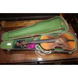 A WELL USED CASED VIOLIN AND BOW