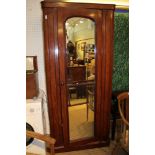 A 19TH CENTURY MAHOGANY MIRROR PANELLED SINGLE DOOR HALL ROBE with full width hanging rail and