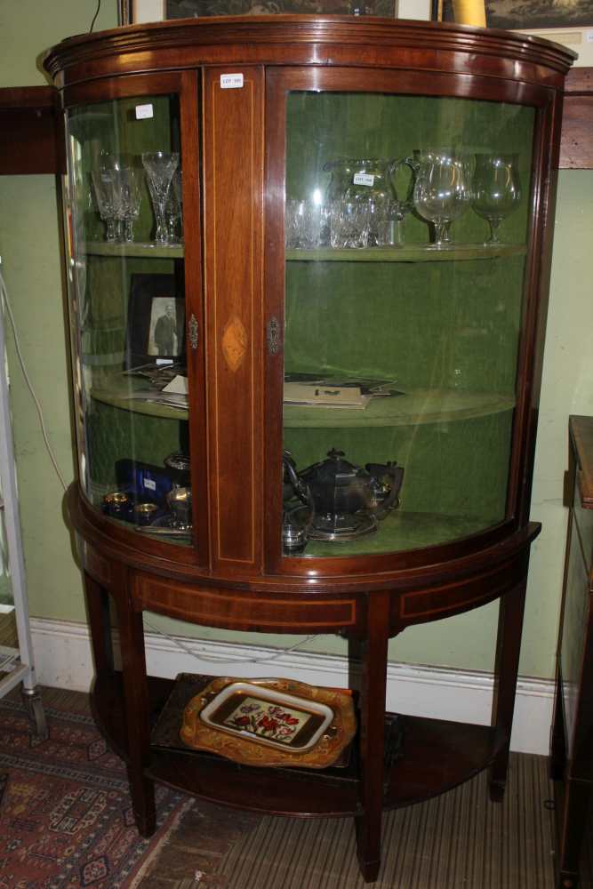 A LARGE LATE 20TH CENTURY MAHOGANY BOW FRONT DISPLAY CABINET, having two plain glazed doors, with