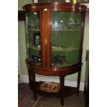 A LARGE LATE 20TH CENTURY MAHOGANY BOW FRONT DISPLAY CABINET, having two plain glazed doors, with