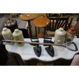 A METAL SHAFTED SHOOTING STICK, four flat irons and four stoneware hot water bottles