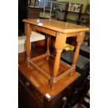 A LIGHT OAK RECTANGULAR TOPPED COFFEE TABLE on baluster and block legs with plain box stretcher