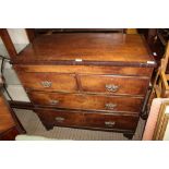 A 19TH CENTURY MAHOGANY FOUR DRAWER CHEST, having crossbanded top over two inline and two full width