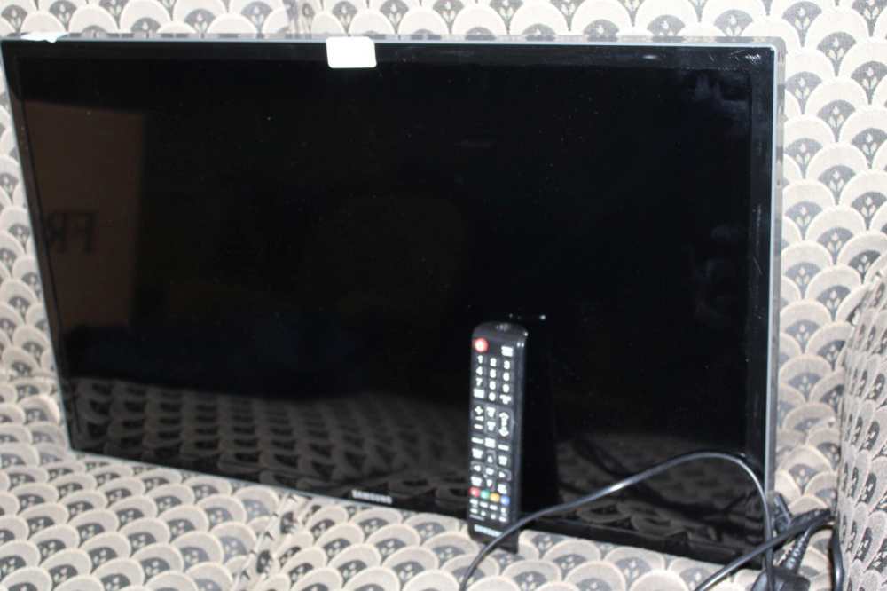 A WALL MOUNTING REMOTE CONTROL SAMSUNG FLATSCREEN TELEVISION