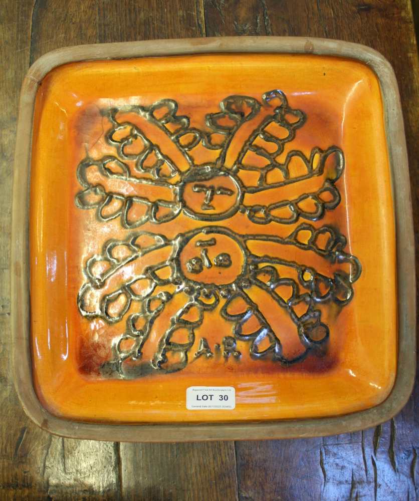 MARGERY CLINTON A STUDIO POTTERY TERRACOTTA DISH, glazed in volcanic orange with applied