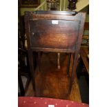 A LATE 19TH CENTURY MAHOGANY FINISHED BEDSIDE POT CUPBOARD on slender square formed tapering legs