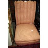 A LATE 19TH / EARLY 20TH CENTURY NURSING TYPE CHAIR re-upholstered in graphic block fabric, with