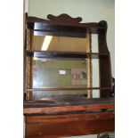 A GILT FRAMED BEVELLED PLATE WALL MIRROR together with a set of hanging shelves