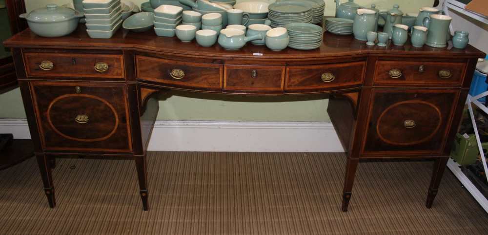 A 19TH CENTURY SHERATON STYLE MAHOGANY SIDEBOARD with satinwood inlay, having bow front central