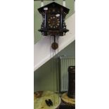 A TRADITIONAL DESIGN WOODEN CASED CUCKOO CLOCK