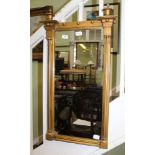 A PROBABLE 19TH CENTURY RECTANGULAR PLAIN PLATE WALL MIRROR in classical gilt coloured frame, with