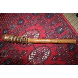 A CARVED WOODEN PROBABLE TRIBAL CLUB