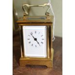 A VERY SMALL SIZED BRASS CASED CARRIAGE CLOCK