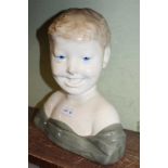 A CONTINENTAL POTTERY BUST OF A CHILD, 29cm high, (factory mark inside)