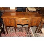 A 19TH CENTURY MAHOGANY SERPENTINE FRONTED SIDEBOARD with decorative inlaid drawers and single