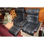 TWO BLACK LEATHER UPHOLSTERED STRESSLESS EKORNES MANUALLY RECLINING ARMCHAIRS, and one footstool