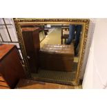 A LARGE FANCY GILT FRAMED BEVELLED PLATE MIRROR