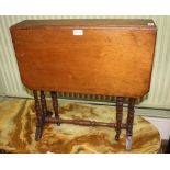 A LATE 19TH CENTURY MAHOGANY TWIN FLAP SMALL SIZED SUTHERLAND TABLE on ring turned supports