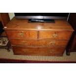A LATE 19TH CENTURY OAK FOUR DRAWER CHEST