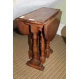 A CRAFTSMANS MADE SMALL SIZED TWIN FLAP GATELEG COFFEE TABLE on baluster turned and blocked supports