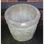 A CAST CONCRETE GARDEN PLANTER