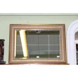 A FANCY GILT FRAMED RECTANGULAR BEVEL PLATE WALL MIRROR