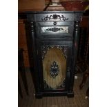 A BLACK FINISHED POT CUPBOARD with mirror insert drawer, and single cupboard door