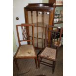 A FLOOR STANDING GLASS FRONTED DISPLAY CASE, together with two single bedroom type chairs