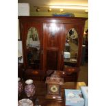 A FIRST-QUARTER 20TH CENTURY INLAID WALNUT WARDROBE having plain cornice over panelled central
