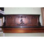 A FIRST QUARTER 20TH CENTURY FANCY CARVED DISPLAY SHELF