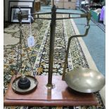 A SET OF 'VANDOME, TITFORD & CO. LTD' LONDON BRASS BALANCE SCALES, on mahogany base board, with