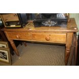 A 19TH CENTURY PINE SIDE TABLE fitted two inline drawers, on four plain turned legs